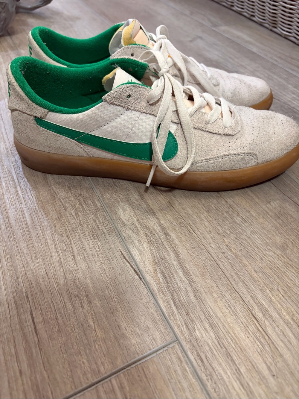 Nike sneakers with green swoosh